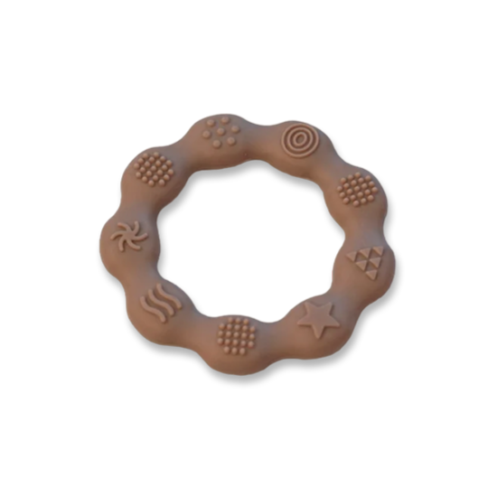 Textured silicone teething ring in earthy tone, designed for soothing baby’s gums with multiple sensory patterns.