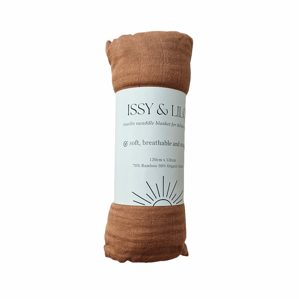 A rolled-up milk chocolate bamboo swaddle blanket, neatly secured with a white paper band featuring branding details. The soft fabric indicates comfort and breathability, perfect for wrapping infants.