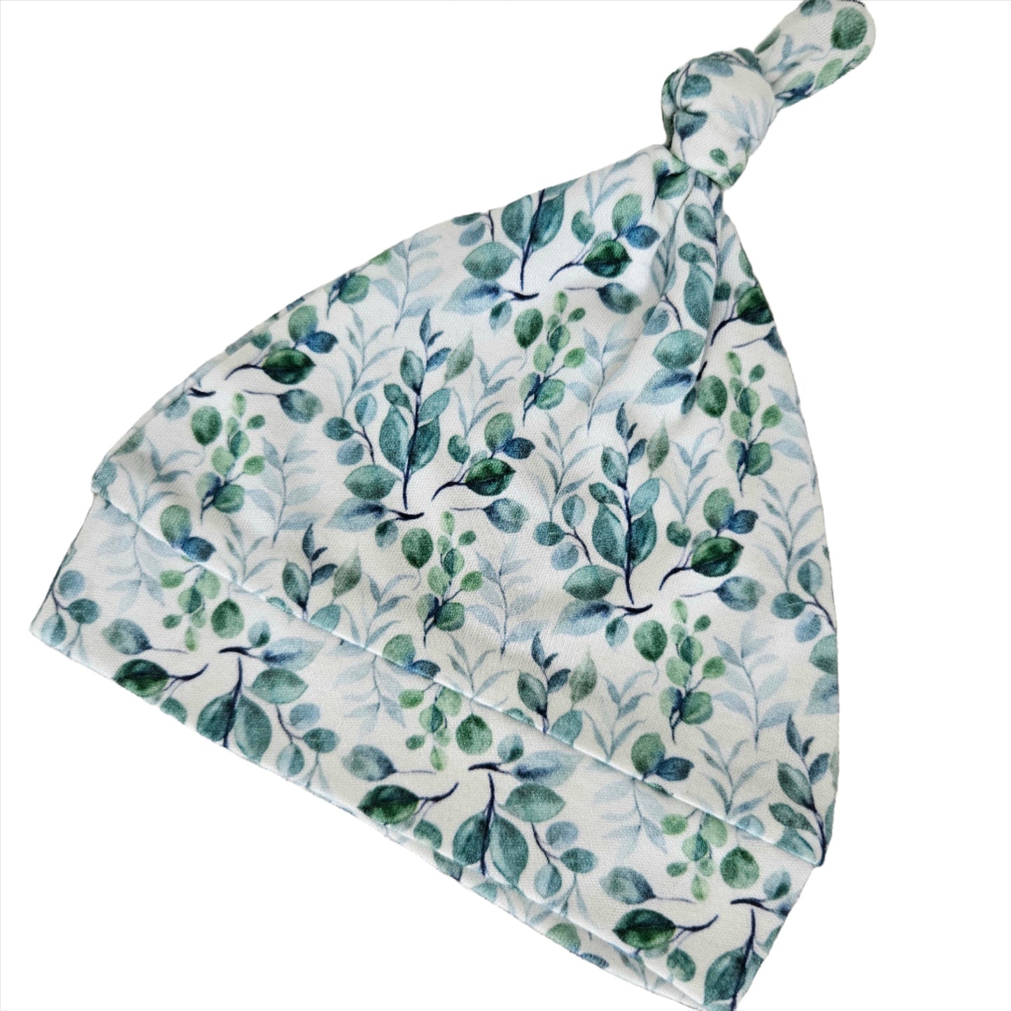 Knotted baby beanie in Green Leaf pattern, made from soft bamboo fabric.