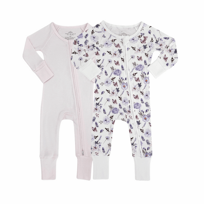 Two bamboo zipper rompers for babies, one in solid beige and the other with a colorful floral print, designed for comfort and easy diaper changes.
