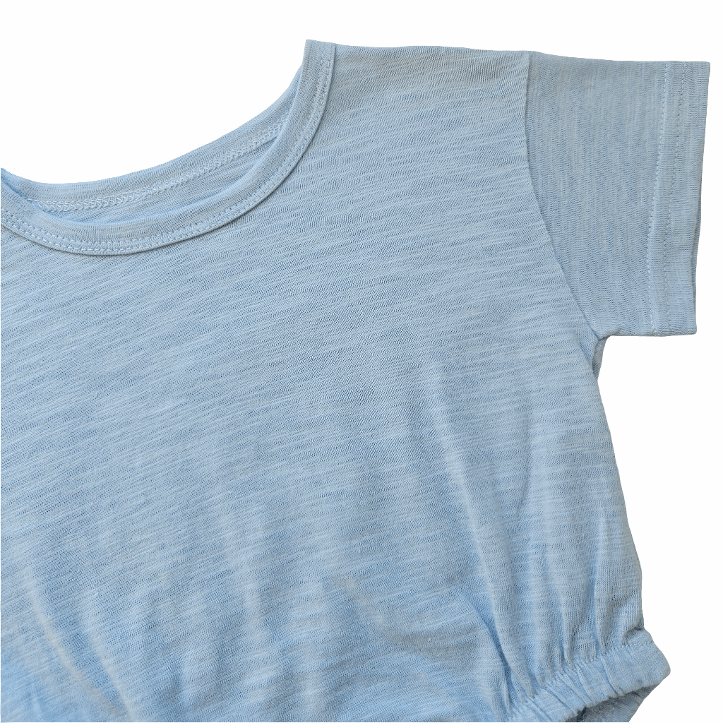 Close-up of Issy & Lilo light blue organic cotton baby bodysuit, highlighting short sleeves and soft fabric