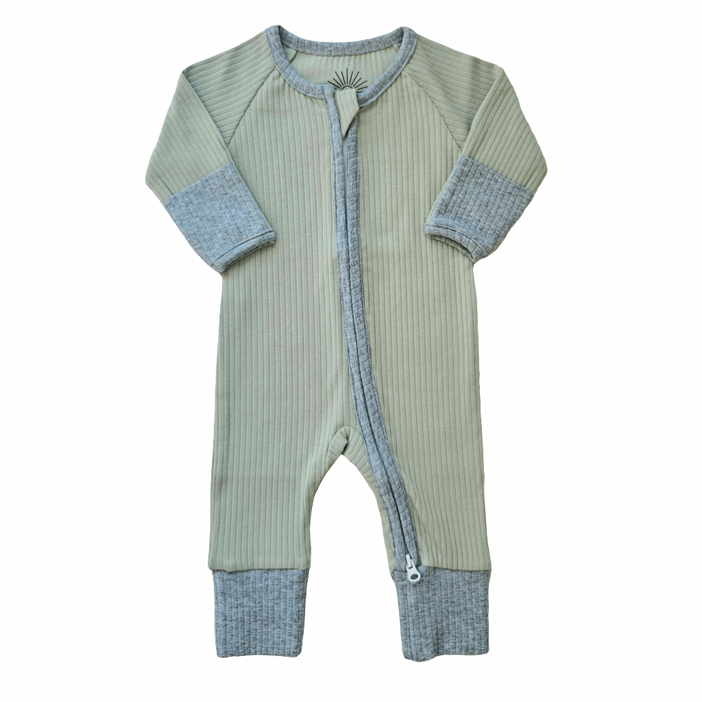 Smart organic cotton zipper romper in sage green with contrasting cuffs and trim, laid flat on a white background.