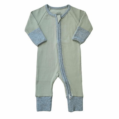 Smart organic cotton zipper romper in sage green with contrasting cuffs and trim, laid flat on a white background.