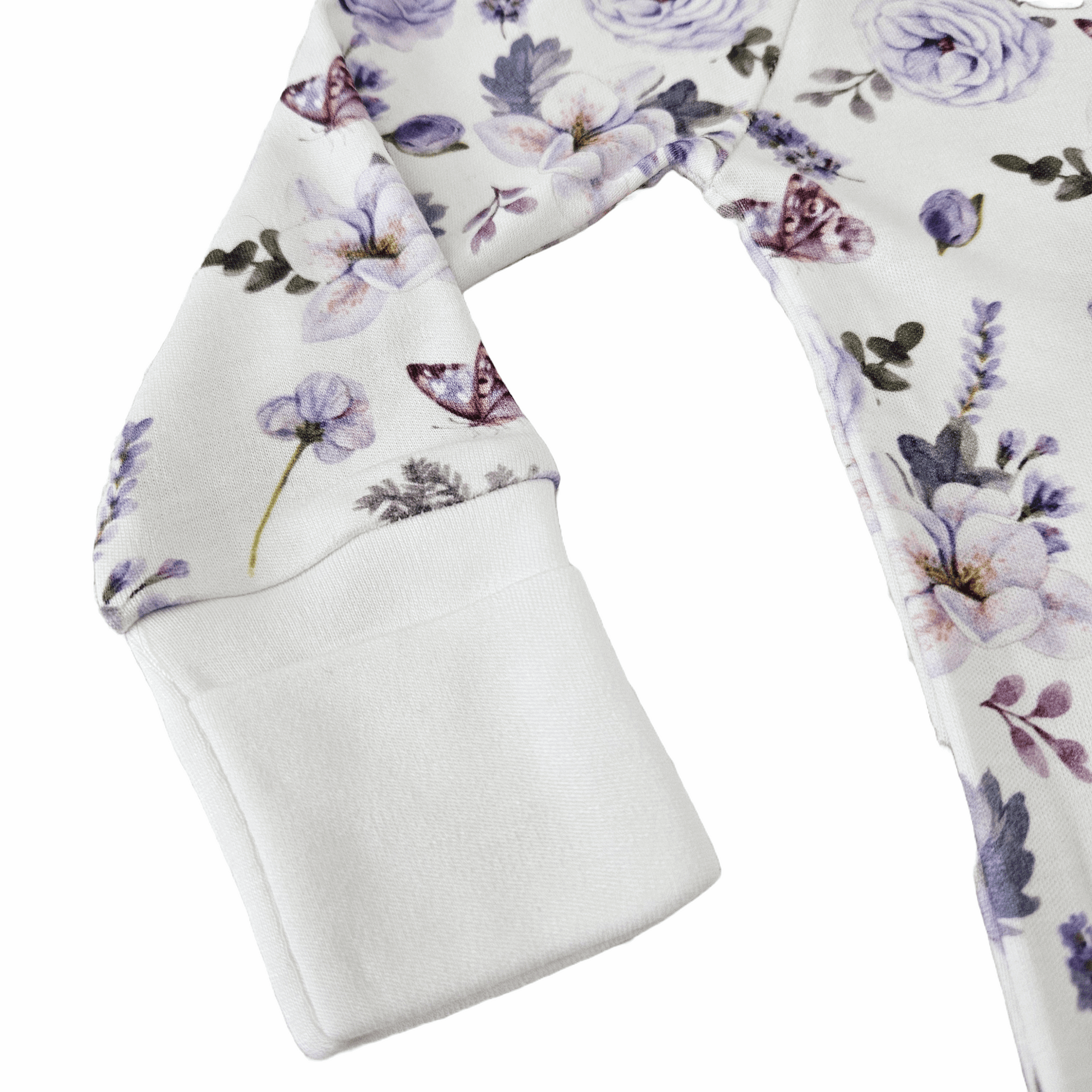 Floral print long sleeve romper with purple and pink flowers, butterflies, and soft white cuffs from Issy & Lilo’s bamboo and organic cotton collection, designed for sensitive baby skin.